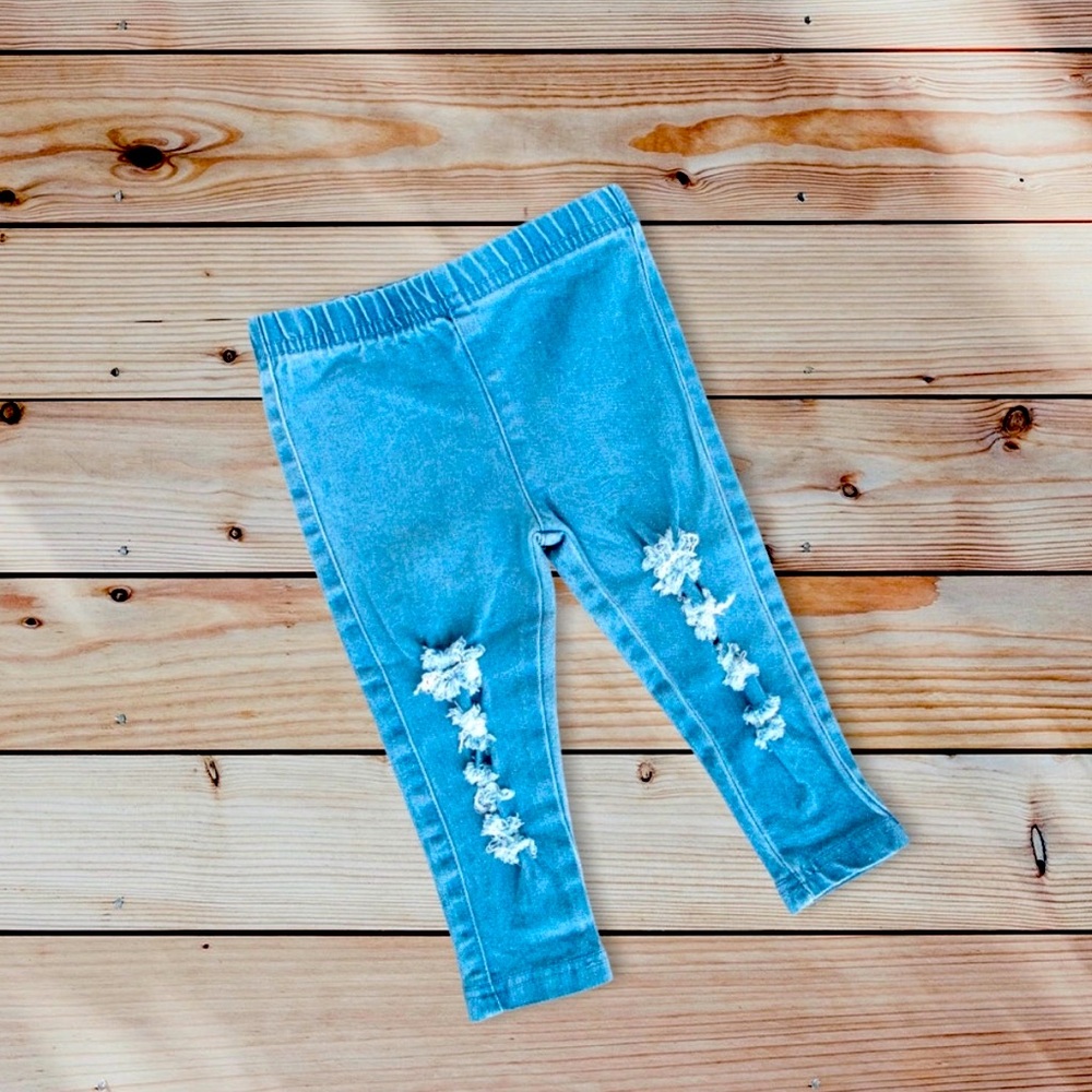 Distressed denim jeans